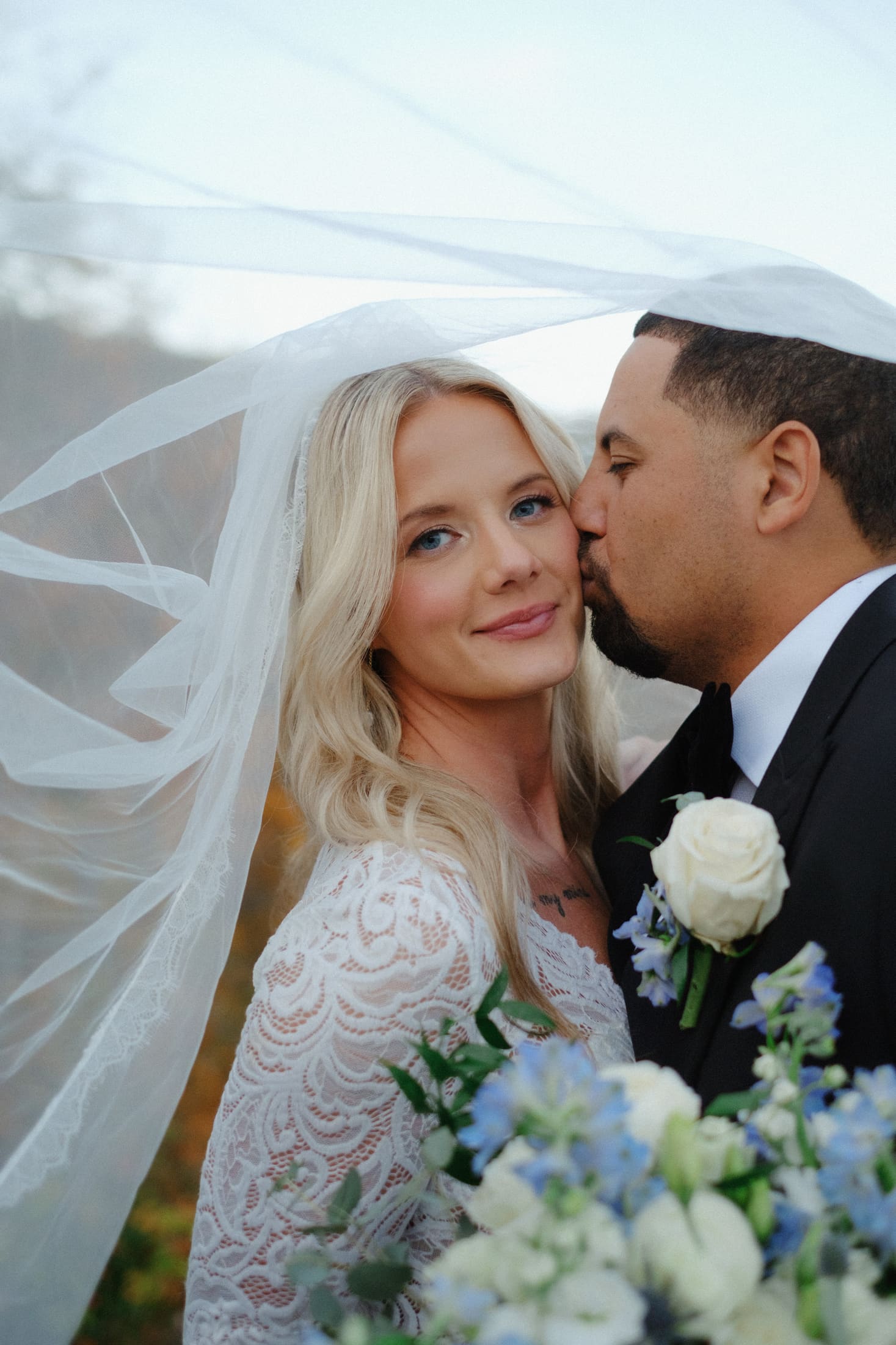 Bride and groom smiling together after getting ready