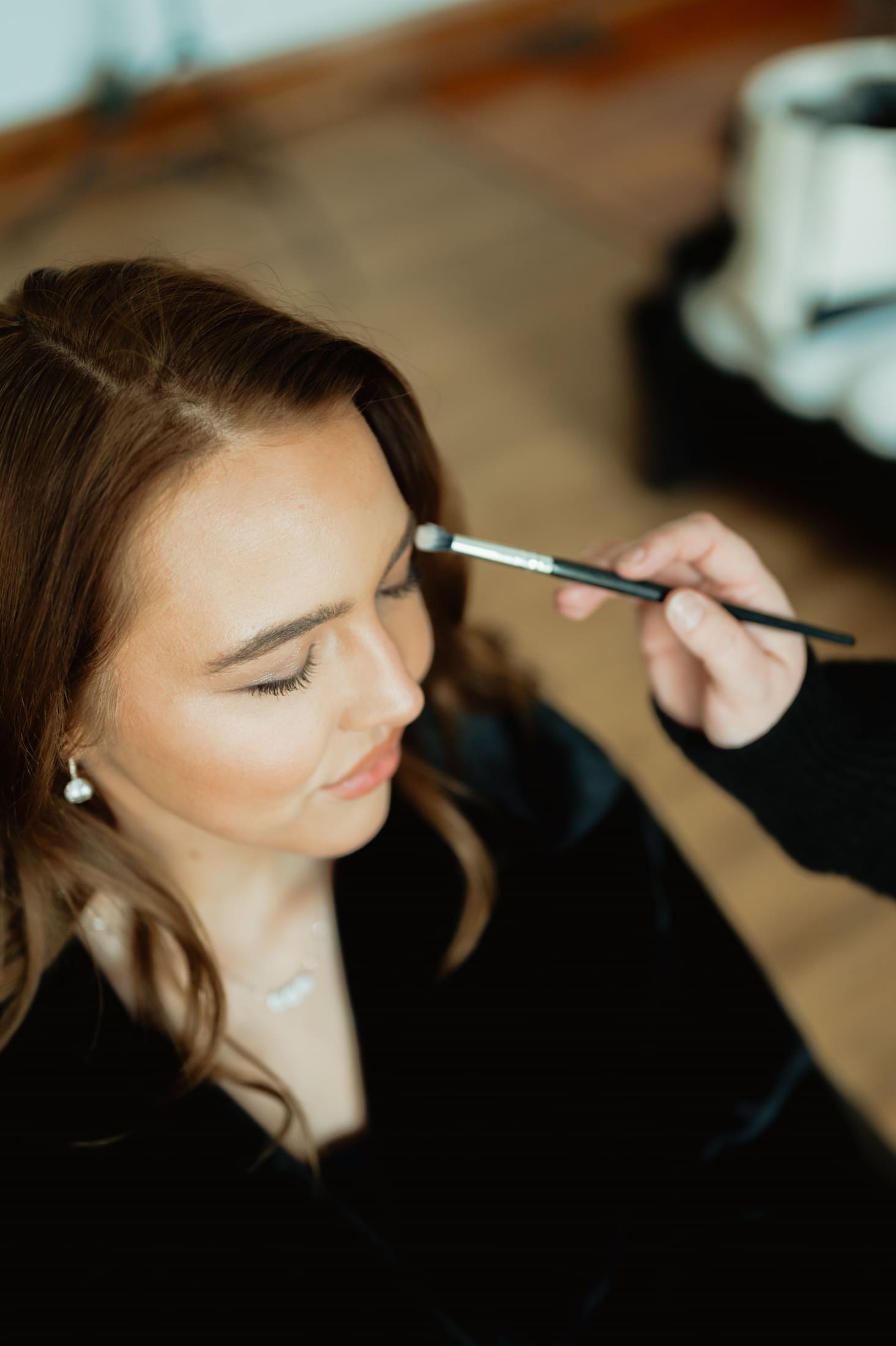Bride having makeup applied